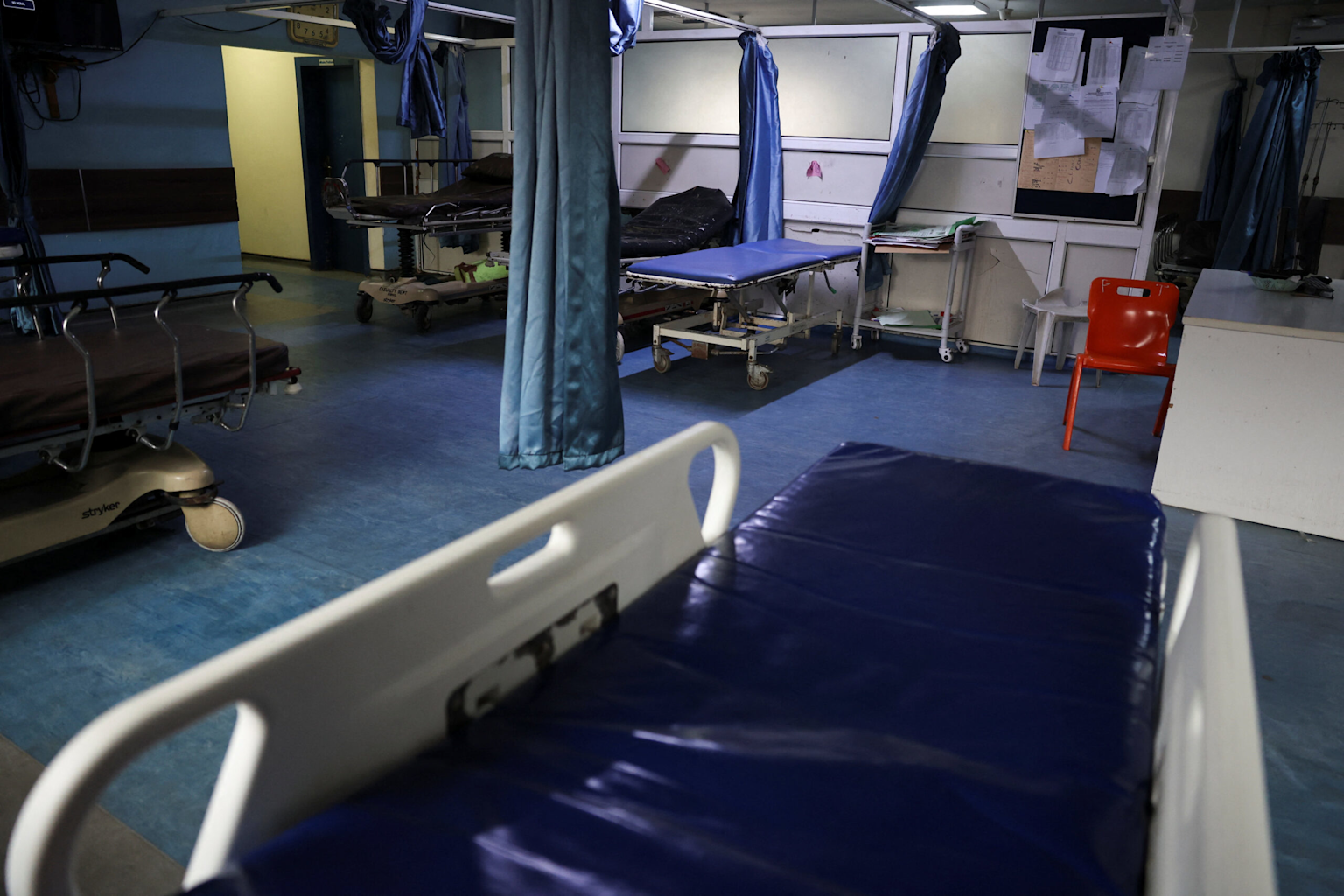 Empty hospital beds and neglected ward illustrating resource challenges in healthcare facilities